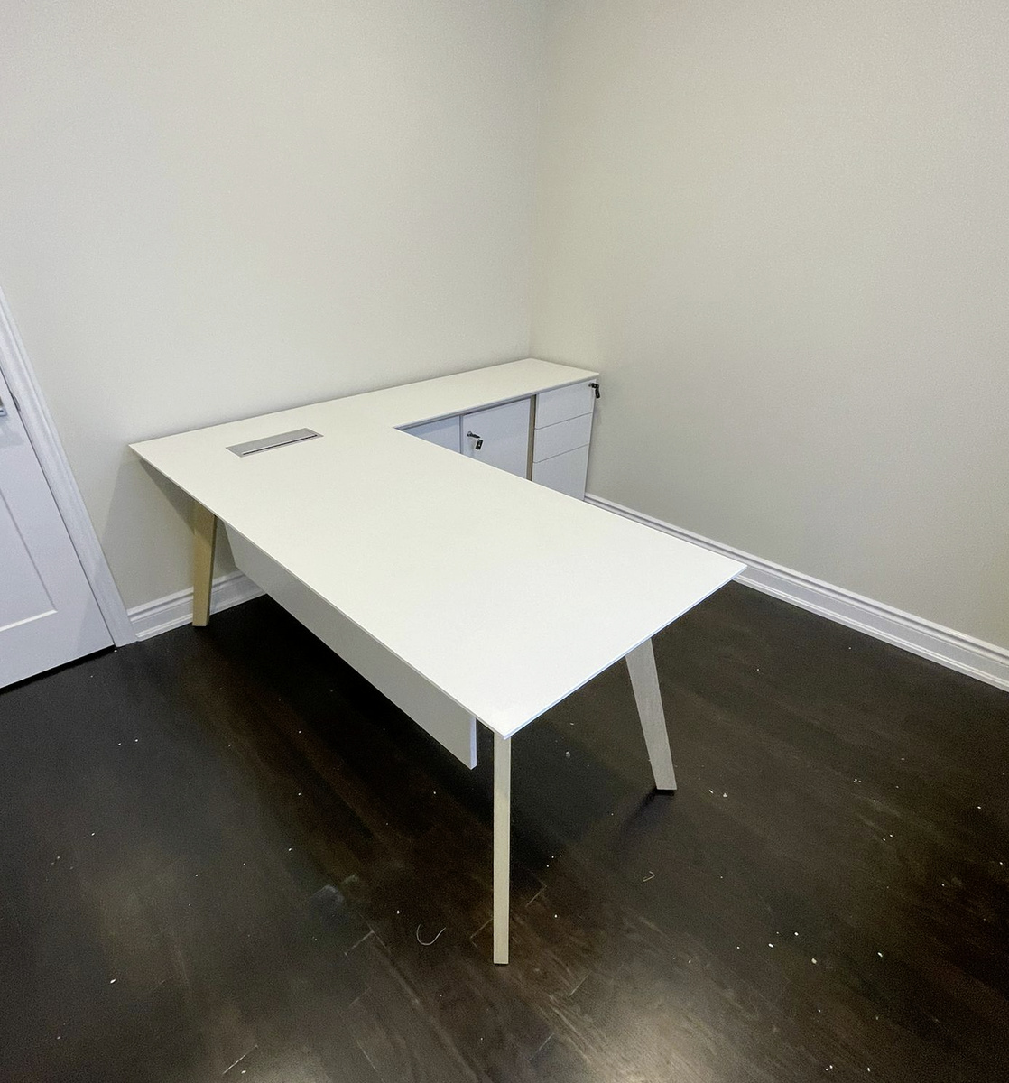 White Executive Desk With Beveled Edges And An Angular Leg Design ...